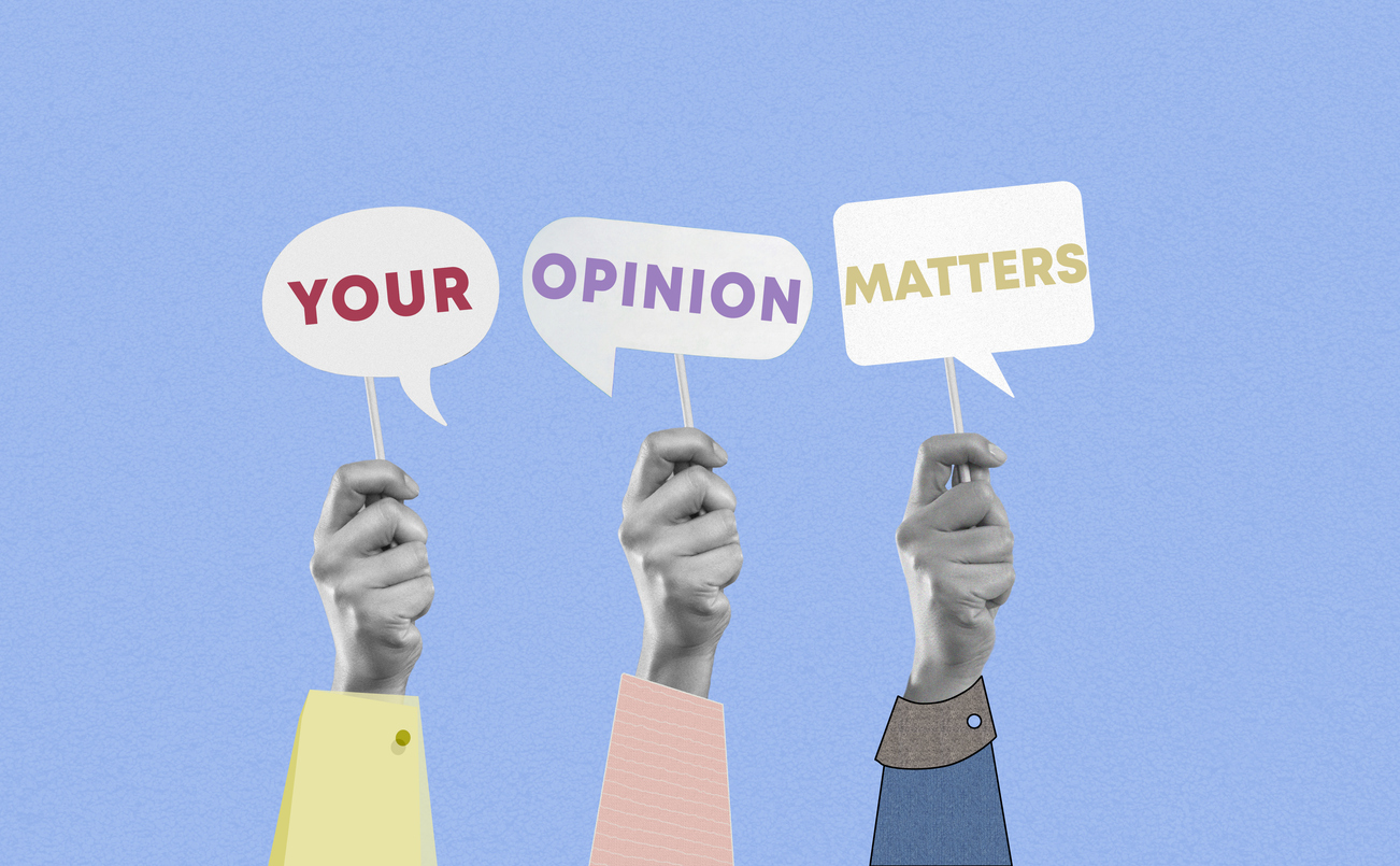 Group of paper hands showing your opinion matters words on speech bubble cards on blue background Credit: anilakkus